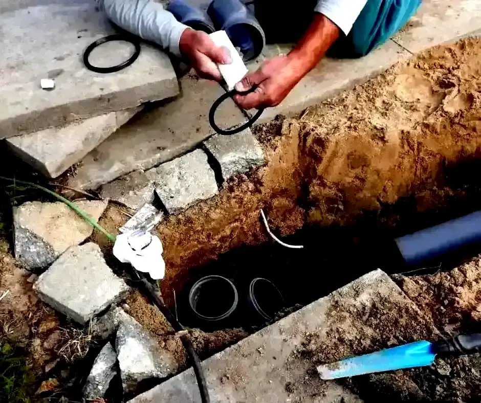 Hands assembling French Drain Installation Boston, MA